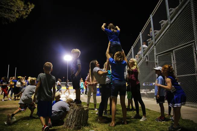 Children play during a Moapa Valley vs Cheyenne game at Moapa Valley High School, Friday, Sep. 14, 2018.