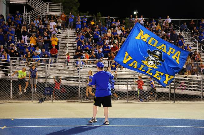 A Moapa Valley student waves a flag during a Moapa Valley vs Cheyenne game, Friday, Sep. 14, 2018.