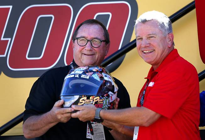 Rossi Ralenkotter, former CEO of the Las Vegas Convention and Visitors Authority, receives a commemorative helmet from Chris Powell, president and general manager, during the South Point 400 NASCAR Cup series race at the Las Vegas Motor Speedway Sunday, Sept. 16, 2018.