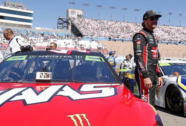 Kurt Busch stands by his car before the start of the South Point 400 NASCAR Cup series race at the Las Vegas Motor Speedway Sunday, Sept. 16, 2018.