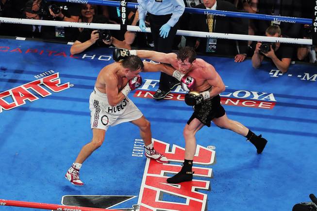 WBC/WBA middleweight champion Gennady Golovkin of Khazakstan and Canelo Alvarez of Mexico battle during their title fight at T-Mobile Arena Saturday, Sept. 15, 2018.