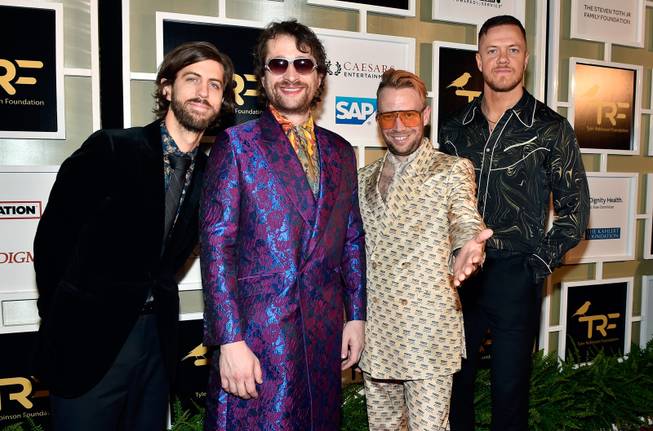 From left, guitarist Wayne Sermon, drummer Daniel Platzman, bassist Ben McKee, and frontman Dan Reynolds of Imagine Dragons arrive at the fifth annual Rise Up Gala at Caesars Palace Friday, Sept. 14, 2018, in Las Vegas. The star-studded event was created to raise funds for The Tyler Robinson Foundation, the Imagine Dragons nonprofit organization dedicated to supporting families with pediatric cancer diagnoses.
