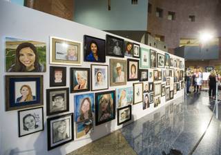 Portraits honoring the 58 victims of the Oct. 1 shooting are displayed as part of the Las Vegas Portraits Project exhibit at the Clark County Government Center in Las Vegas on Monday, Sept. 17, 2018.