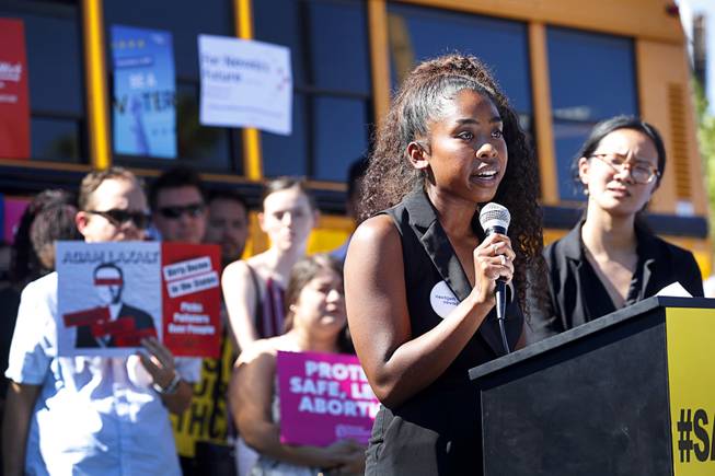 Sierra Bumanglag, an organizer with NexGen Nevada, speaks during a "Hop on the Progress Bus" news conference in an office park parking lot on West Sahara Avenue Wednesday, Sept. 19, 2018. NexGen Nevada concentrates on getting young people to vote on issues of climate, immigration, equality and healthcare.