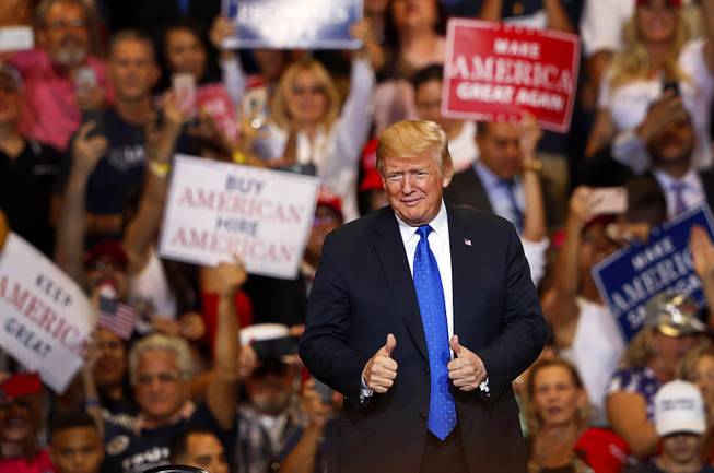 President Donald Trump gives two thumbs up after arriving at a "Make America Great Again (MAGA) rally at the Las Vegas Convention Center Thursday, Sept. 20, 2018.
