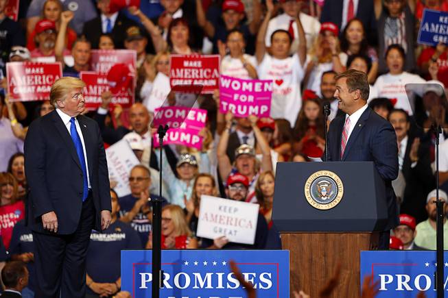 Sen. Dean Heller, right, R-Nev., shares the stage with President Donald Trump during a "Make America Great Again (MAGA) rally at the Las Vegas Convention Center Thursday, Sept. 20, 2018.