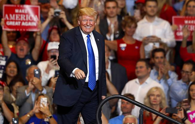 President Donald Trump leaves the stage at the conclusion of his rally at the Las Vegas Convention Center Thursday, Sept. 20, 2018.