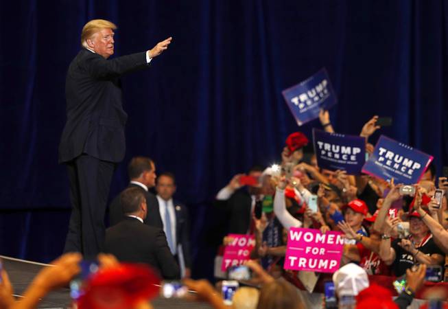 President Donald Trump waves as he leaves a "Make America Great Again (MAGA) rally at the Las Vegas Convention Center Thursday, Sept. 20, 2018.
