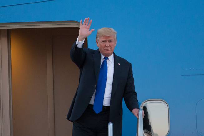 President Donald Trump arrives at McCarran International Airport, Thursday, Sept. 20, 2018, to speak at a rally at the Las Vegas Convention Center.
