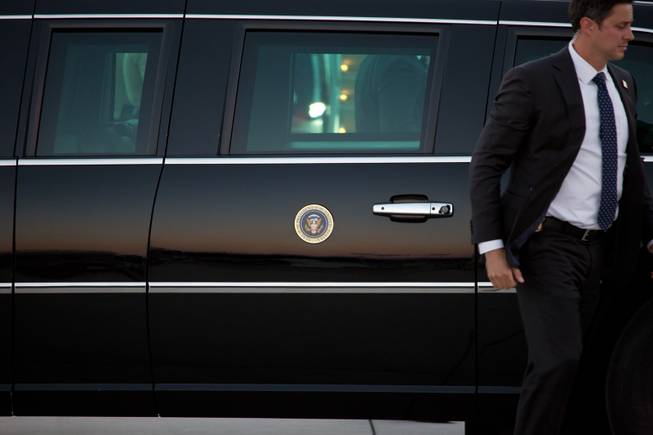 Secret Service Agents provide security as President Trump arrives at McCarran International Airport Thursday Sept. 20, 2018.