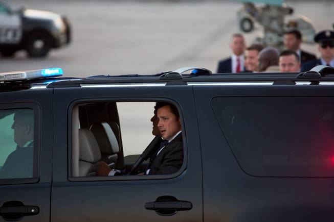 Secret Service Agents provide security as President Trump arrives at McCarran International Airport Thursday Sept. 20, 2018.
