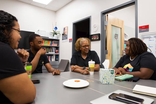 From left, Masumi Hicks, Caleb Green,  director Harriet Barlow and Charmaine Wilcox have a discussion at Intersection's resource center inside the UNLV Student Union,  Friday Sept. 21, 2018.