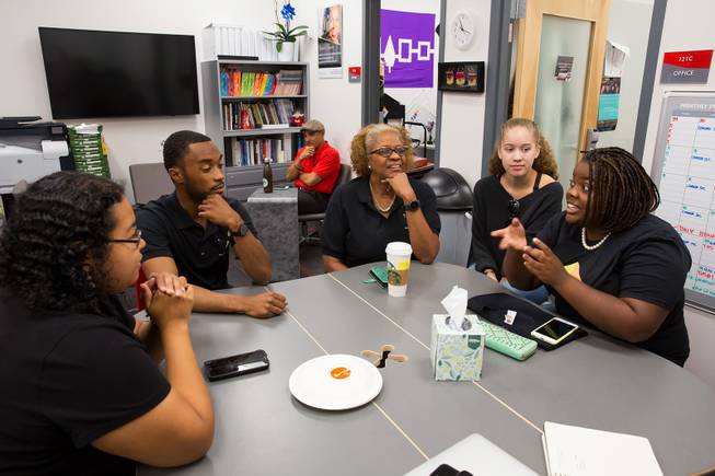 From left, Masumi Hicks, Caleb Green,  director Harriet Barlow, Kiara Sims and Charmaine Wilcox have a discussion at Intersection's resource center inside the UNLV Student Union,  Friday Sept. 21, 2018.