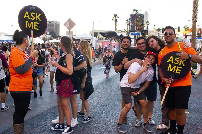 Guides interact with festivalgoers duringthe first day of the Life is Beautiful music festival in downtown Las Vegas, Friday, Sept. 21, 2018.