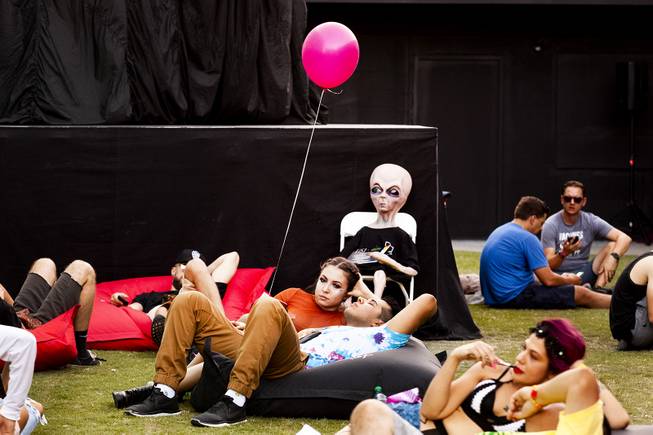 Festivalgoers rest in the Area15 promotional area during the second day of the Life is Beautiful music festival in downtown Las Vegas, Saturday, Sept. 22, 2018.