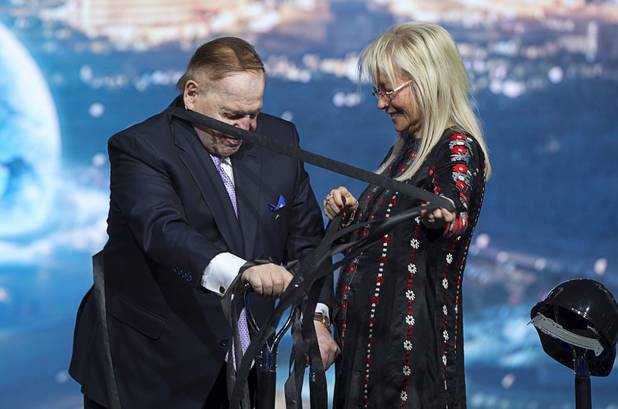 Miriam Adelson removes streamers, used in the MSG Sphere at the Venetian groundbreaking ceremony, from her husband Sheldon Adelson, chairman/CEO of Las Vegas Sands, by Koval Lane and Sands Avenue Thursday, Sept. 27, 2018. The new venue is expected to be completed in fiscal 2021 (July 1, 2020-June 30, 2021). 