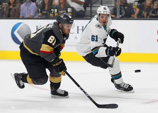 Vegas Golden Knights center Jonathan Marchessault (81) and San Jose Sharks defenseman Justin Braun (61) vie for the puck during the first period of a preseason NHL hockey game Sunday, Sept. 30, 2018, in Las Vegas.