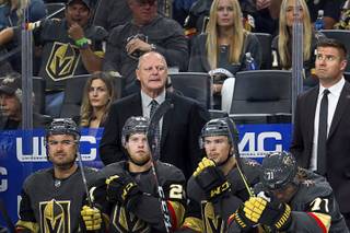 Vegas Golden Knights head coach Gerard Gallant, center, watches play in the second period during the Knight's season opener against the Philadelphia Flyers at T-Mobile Arena Thursday, Oct. 4, 2018.