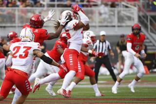 New Mexico Lobos linebacker Evahelotu Tohi (45) intercepts a pass intended for UNLV Rebels wide receiver Darren Woods Jr. (10) during their NCAA football game Saturday, October 6, 2018, at Sam Boyd Stadium in Las Vegas.