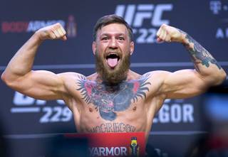 Conor McGregor of Ireland poses on the scale during a ceremonial weigh-in for UFC 229 at T-Mobile Arena in Las Vegas Friday, Oct. 5, 2018. McGregor will challenge UFC lightweight champion Khabib Nurmagomedov of Russia for the title at the arena Saturday.