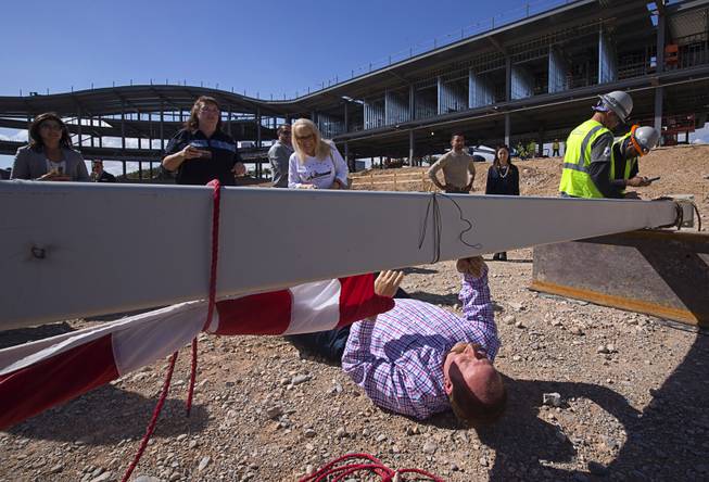 Jason Weber, retail manager for the Las Vegas 51's, signs a steel beam during a topping out ceremony at the Las Vegas Ballpark in Summerlin Thursday, Oct. 11, 2018. The stadium is scheduled to be completed before the team's season opener on April 9, 2019.