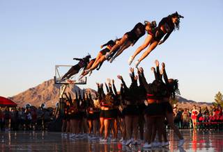 Cheerleaders perform during an exhibition with the UNLV Runnin' Rebels and Lady Rebels in the parking lot of Sam Boyd Stadium before the UNLV-Air Force football game Friday, Oct. 19, 2018.