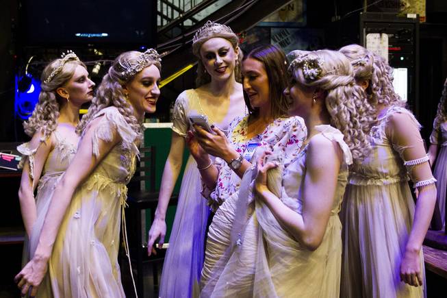 Ballerinas dressed as brides from the Nevada Ballet Theatre's production of "Dracula" react to a photo taken of them prior to their dress rehearsal backstage at the Smith Center, Wednesday, Oct. 24, 2018.