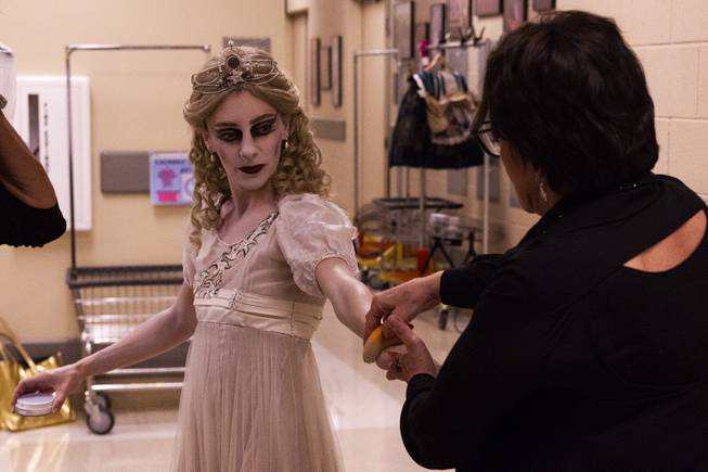 A ballerina dressed as bride gets white makeup applied to her for the Nevada Ballet Theatre's production of "Dracula" prior to their dress rehearsal at the Smith Center, Wednesday, Oct. 24, 2018.