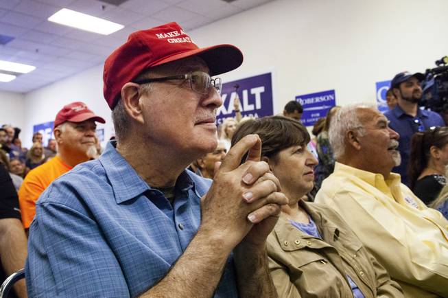 An attendee reacts to Sen. Lindsey Graham's, R-S.C., speech during a campaign office event, Friday, Oct. 26, 2018.