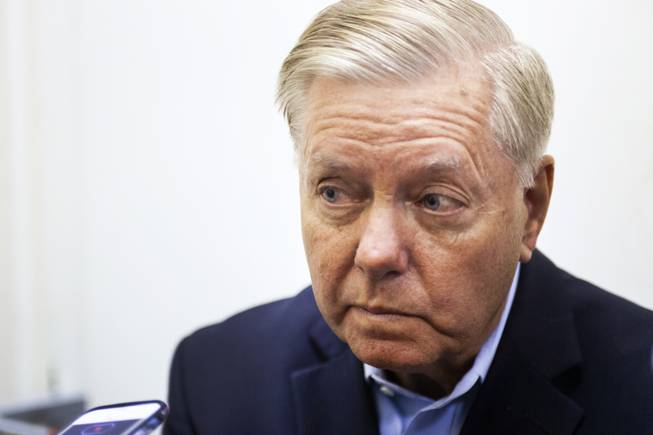 Sen. Lindsey Graham, R-S.C., speaks to reporters following a campaign office event, Friday, Oct. 26, 2018.