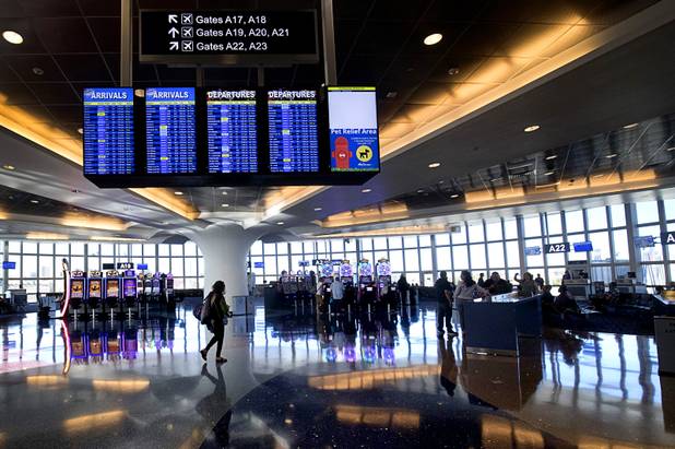 A passenger walks though a newly renovated A-Gates cluster building at McCarran International Airport Thursday, Nov. 1, 2018.
