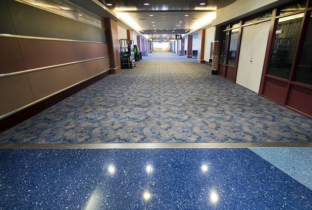 A photo shows where the new flooring stops and the old carpeting begins at the A-B gates in McCarran International Airport Thursday, Nov. 1, 2018. New flooring is among the renovations underway in the A-B Gates.