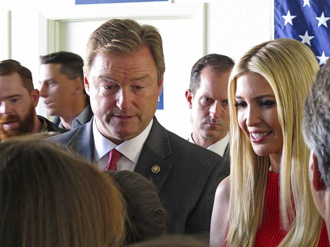Ivanka Trump, President Trump's daughter and advisor, and Nevada Republican Sen. Dean Heller talk to supporters after their speeches at the GOP field office in Reno, Nev., Thursday, Nov. 1, 2018. Ivanka Trump praised Heller for his role in passing the tax bill and the doubling of the child tax credit that came with it. She says she's confident he'll win his battle for re-election against Democratic Rep. Jacky Rosen. 