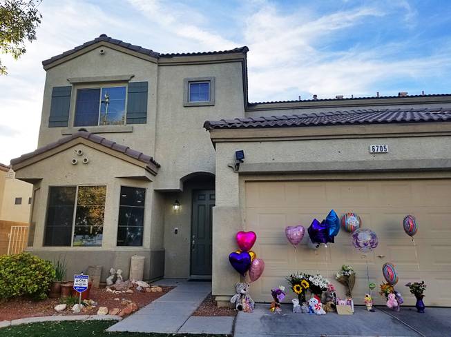 Bullet holes can be seen on this home on Courtney Michelle Street, near Deer Springs Way and Lawrence Street in North Las Vegas. It was targeted by shooters Thursday, Nov. 1, 2018. 