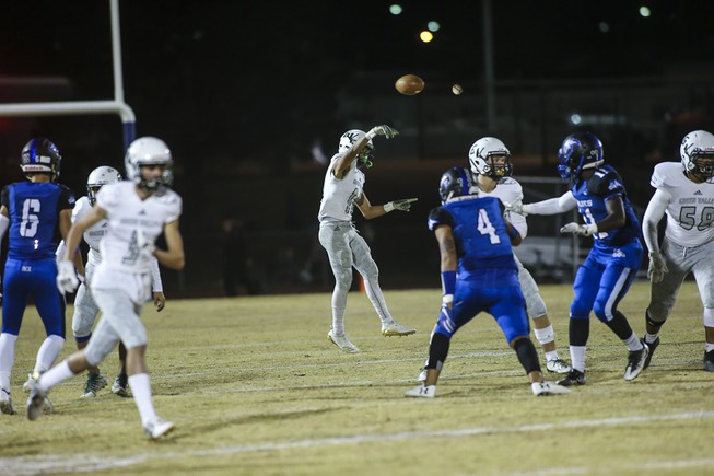 Green Valley's Josh George (11) throws the ball downfield during ...