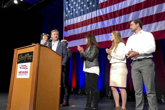 Incumbent GOP Senator Dean Heller takes the stage at the South Point with his family, his grand daughter Ava in hand, to thank all the supporters as they eagerly wait for the Election Day results, Tuesday, Nov. 6, 2018.