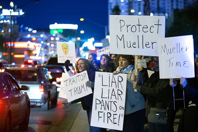 Activists protest in front of the Lloyd D. George Federal Building in downtown Las Vegas Thursday, Nov. 8, 2018. Following the firing of U.S. Attorney General Jeff Sessions, activists are asking that the investigation into alleged Russian interference in the 2016 elections is protected.