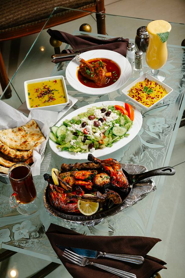 Shiraz restaurant serves Tandoori Mixed Platter, Lamb Shank, Daal Soup, Zereshk Persian Barbery Rice, Garlic Naan, Greek Salad, Mango Lassi and Persian Hot Tea as seen here, Tuesday, Nov. 6, 2018.