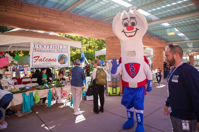 Sporky, CCSD's food service mascot, takes a walk around the Student Farmers Market at the Clark County Government Center, Thursday Nov. 8, 2018.