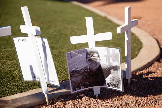 Memorial crosses for victims of the Thousand Oaks shooting massacre are seen near the Welcome to Fabulous Las Vegas sign, Monday, Nov. 12, 2018. Twelve people were killed when a gunman opened fire at a bar in Thousand Oaks, California.