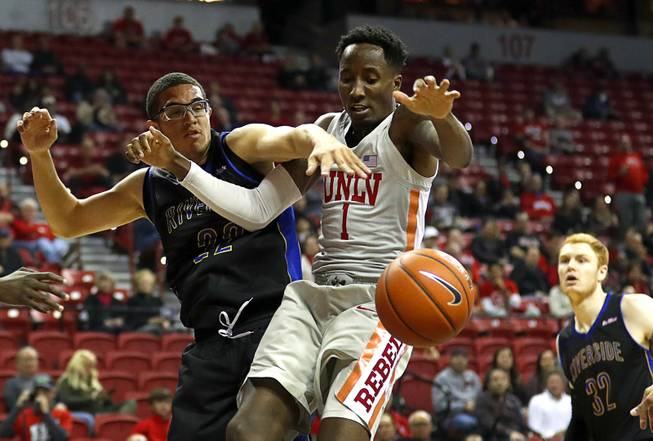 UNLV Rebels guard Kris Clyburn (1) loses control of the ball after a foul by UC Riverside Highlanders guard Dominick Pickett (22) during a game against UC Riverside at the Thomas & Mack Center Tuesday, Nov. 13, 2018.