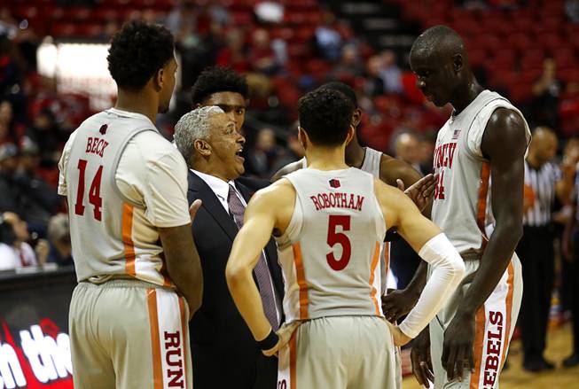 UNLV Rebels head coach Marvin Menzies talks with players during a game against UC Riverside at the Thomas & Mack Center Tuesday, Nov. 13, 2018.