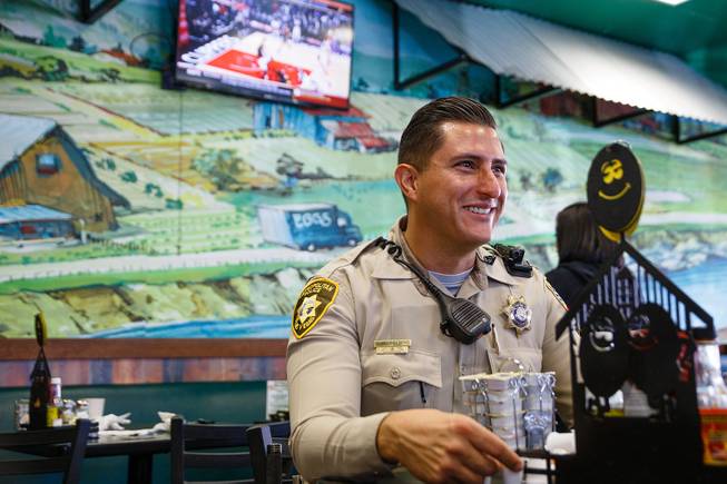 Officer Sergio Felix is interviewed by a reporter (not pictured) during a meet and greet event called Coffee with a Cop hosted by the Las Vegas Metropolitan Police Department at the Egg & I, Wednesday, Nov. 14, 2018.