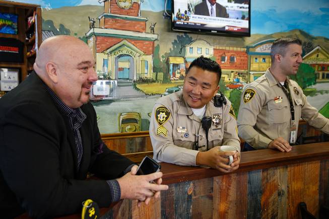 Egg & I Director of Marketing and Officer Josh Younger talk during a meet and greet event called Coffee with a Cop hosted by the Las Vegas Metropolitan Police Department at the Egg & I, Wednesday, Nov. 14, 2018.