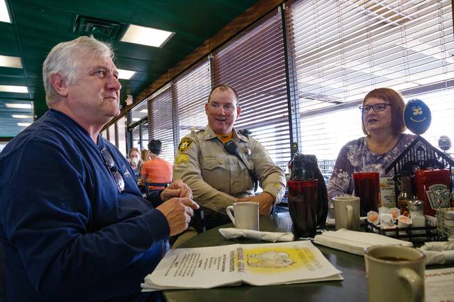 Traffic Sgt. Peter Quinn talks with David & Deborah Bounds during a meet and greet event called Coffee with a Cop hosted by the Las Vegas Metropolitan Police Department at the Egg & I, Wednesday, Nov. 14, 2018.