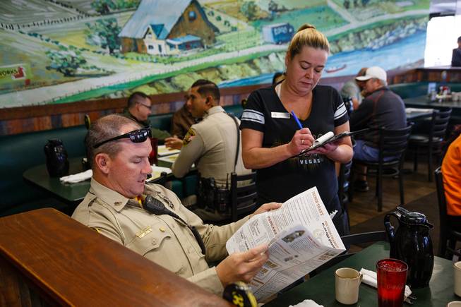 Traffic Sgt. Peter Quinn orders breakfast during a meet and greet event called Coffee with a Cop hosted by the Las Vegas Metropolitan Police Department at the Egg & I, Wednesday, Nov. 14, 2018.