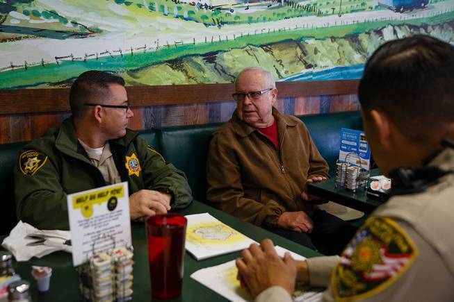 From left, Officer Keith Twigger, Ed Keith and Officer Sergio Felix talk during a meet and greet event called Coffee with a Cop hosted by the Las Vegas Metropolitan Police Department at the Egg & I, Wednesday, Nov. 14, 2018.