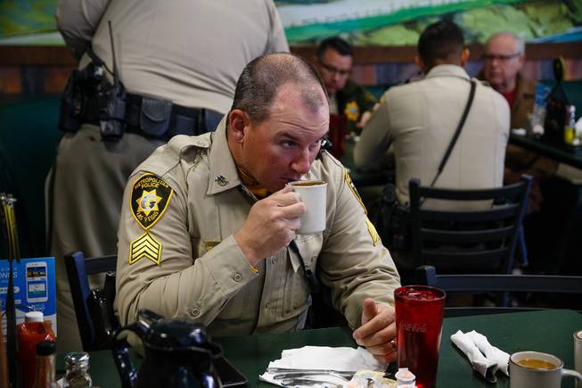 Traffic Sgt. Peter Quinn drinks coffee during a meet and greet event called Coffee with a Cop hosted by the Las Vegas Metropolitan Police Department at the Egg & I, Wednesday, Nov. 14, 2018.