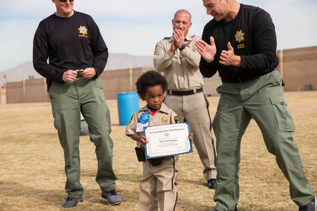 4-year-old Jon'tel Thomas receives an official certificate from the Las Vegas Metropolitan Poice Training Academy and becomes an honorary police officer for the day with help from the Make a Wish Foundation of Southern Nevada, Friday Nov. 16, 2018.
