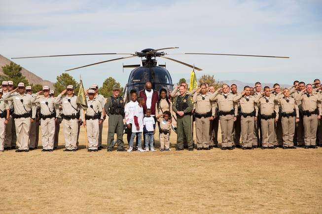 4-year-old Jon'tel Thomas and his family pose for a photo with police trainees and adacemy cadre. Thomas became an honorary police officer for the day with help from the Make a Wish Foundation of Southern Nevada, Friday Nov. 16, 2018.